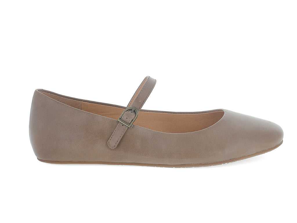 Taupe leather rounded toe flat with over the instep buckle strap on a white background side view