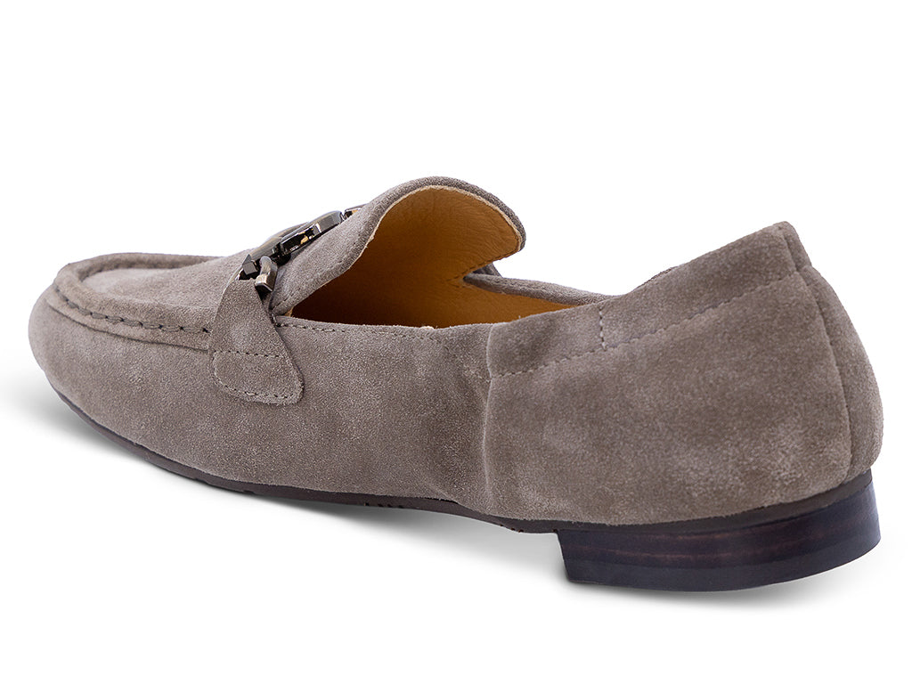 A taupe brown suede loafer with a decorative metal horsebit detail across the vamp - medial side view