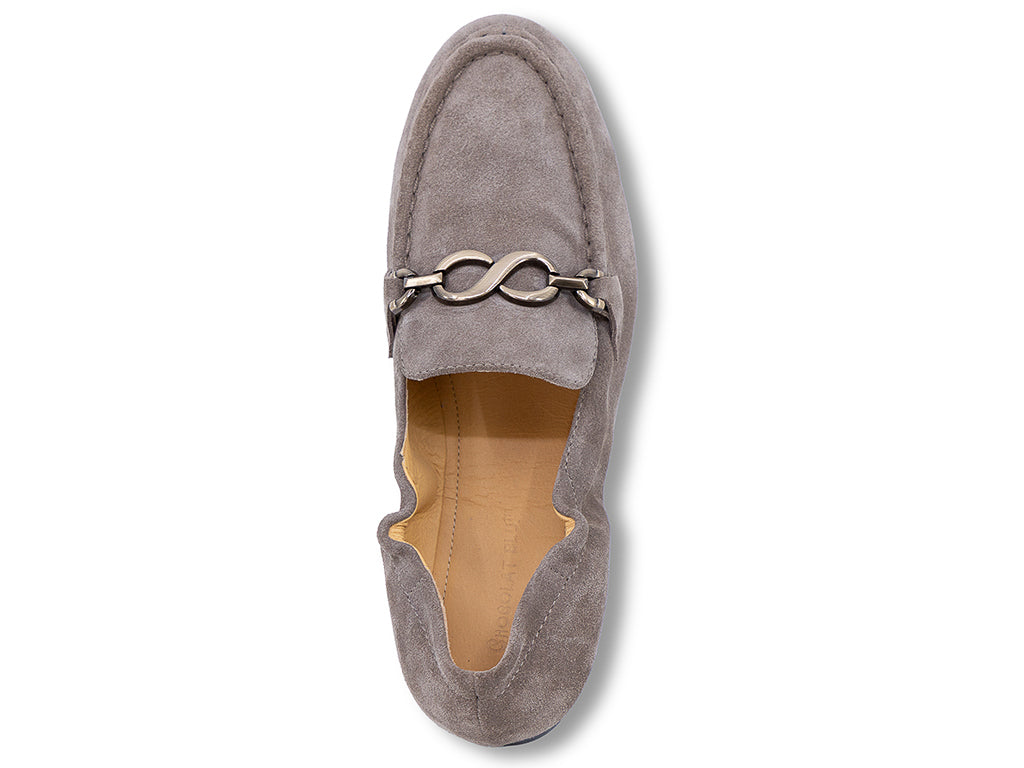 A taupe brown suede loafer with a decorative metal horsebit detail across the vamp - top view