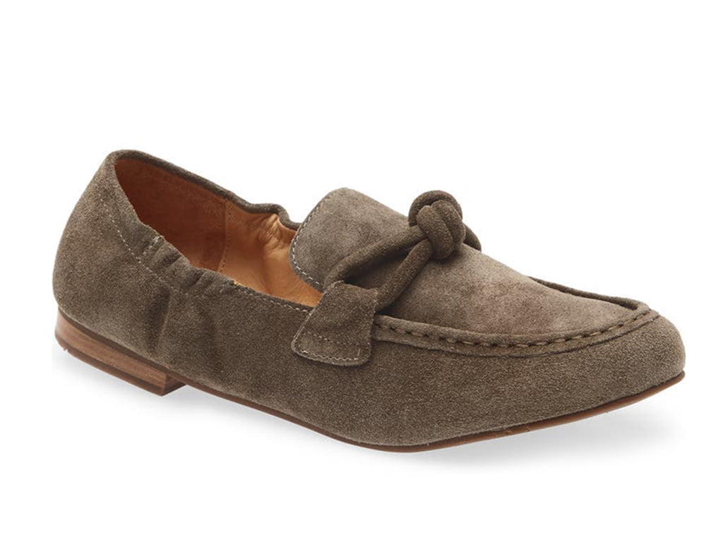 Dark tauoe suede rounded toe flat with decorative cord design and elasticized sides on a white background side angle view