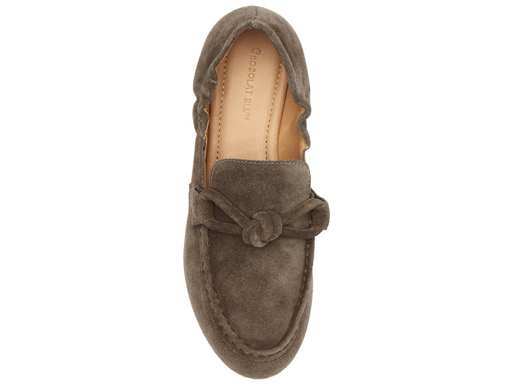 Dark tauoe suede rounded toe flat with decorative cord design and elasticized sides on a white background top view