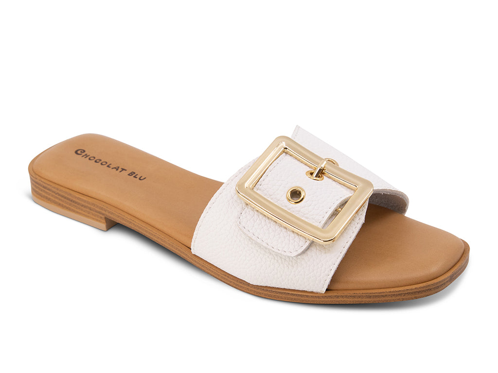 white sandal with gold buckle on a low heel