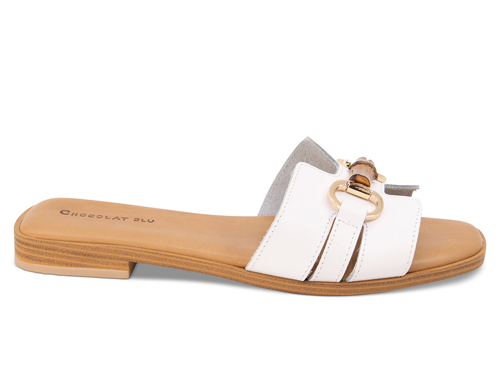 white sandal with bamboo toggle on a low heel - side view