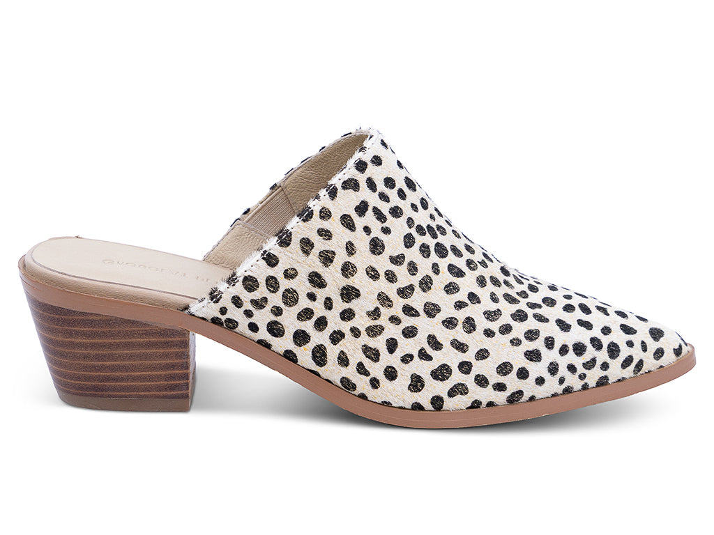 a pointed toe mule with calf hair gold dotted upper and stacked block heel - side view