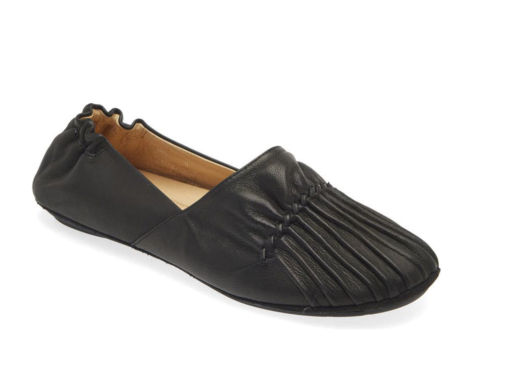 Black leather rounded toe flat with ruched design and elasticized back on a white background side angle view