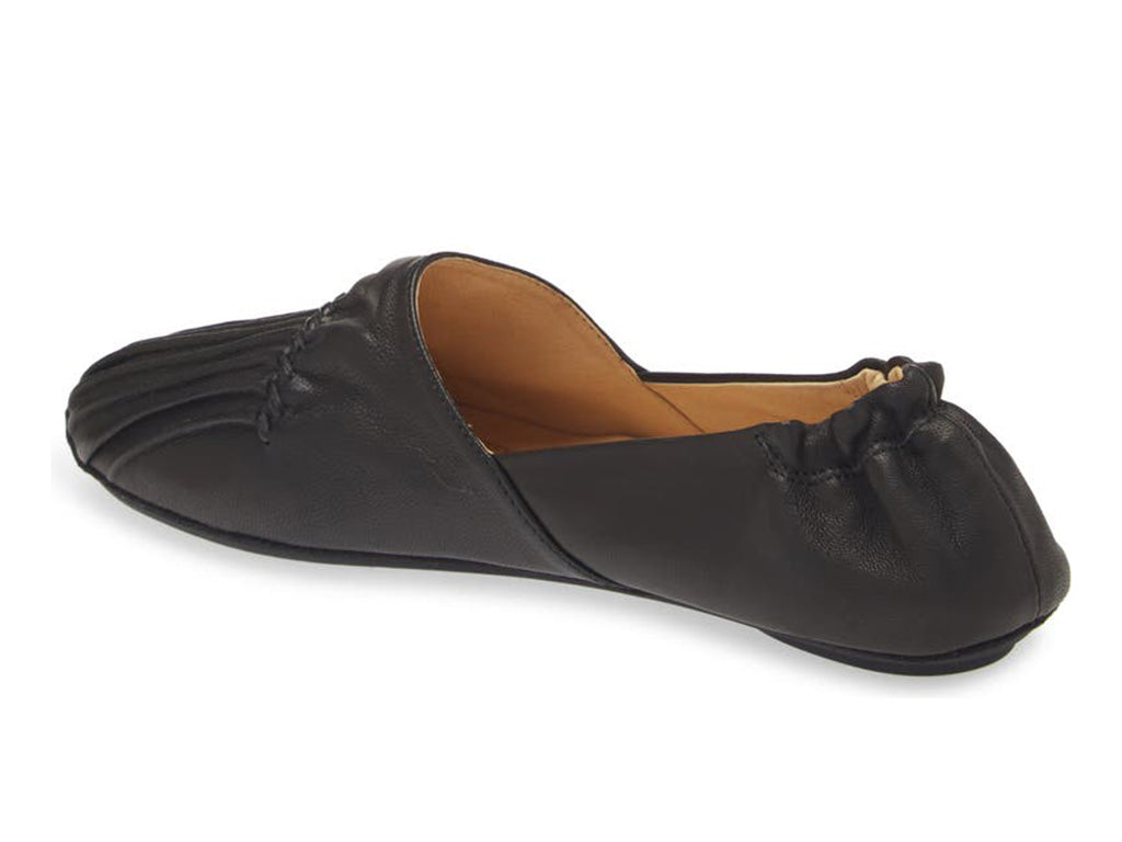 Black leather rounded toe flat with ruched design and elasticized back on a white background side angle view