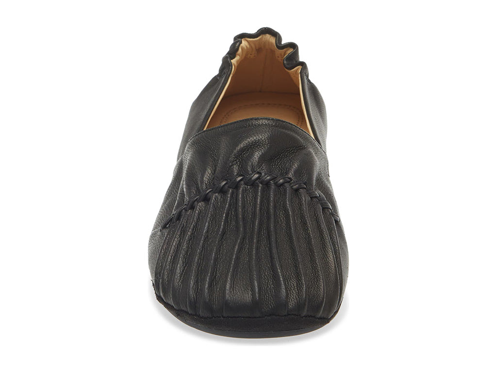 Black leather rounded toe flat with ruched design and elasticized back on a white background front view