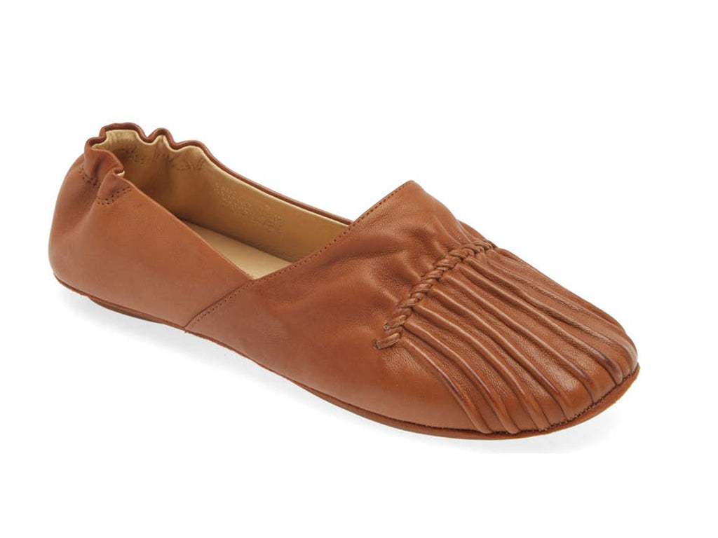 Camel leather rounded toe flat with ruched design and elasticized back on a white background side angle view