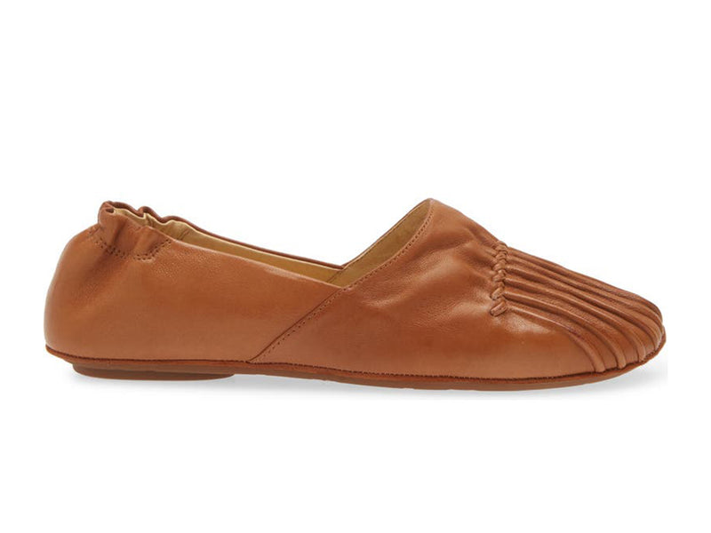 Camel leather rounded toe flat with ruched design and elasticized back on a white background side view