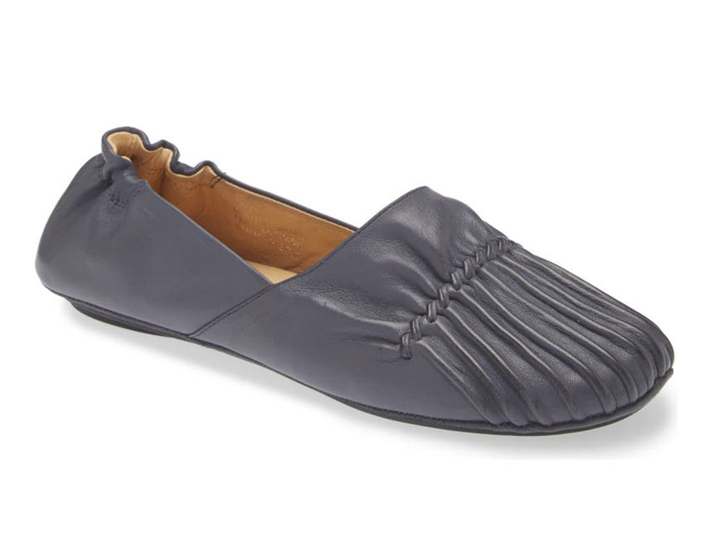 Navy leather rounded toe flat with ruched design and elasticized back on a white background side angle view