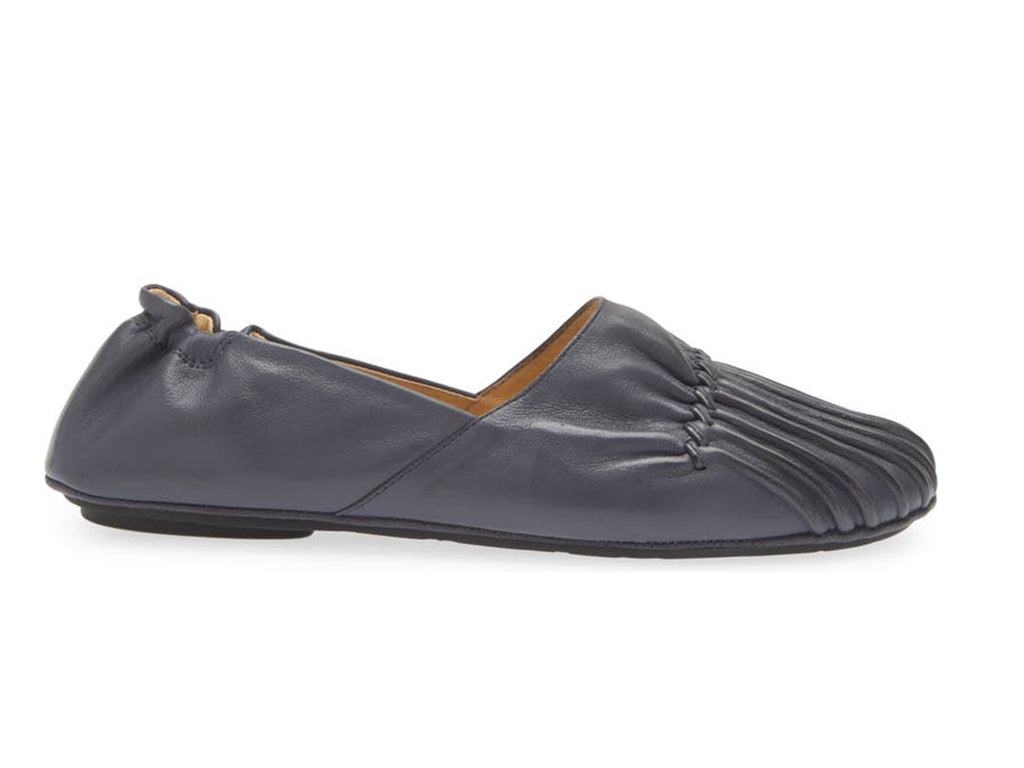 Navy leather rounded toe flat with ruched design and elasticized back on a white background side view