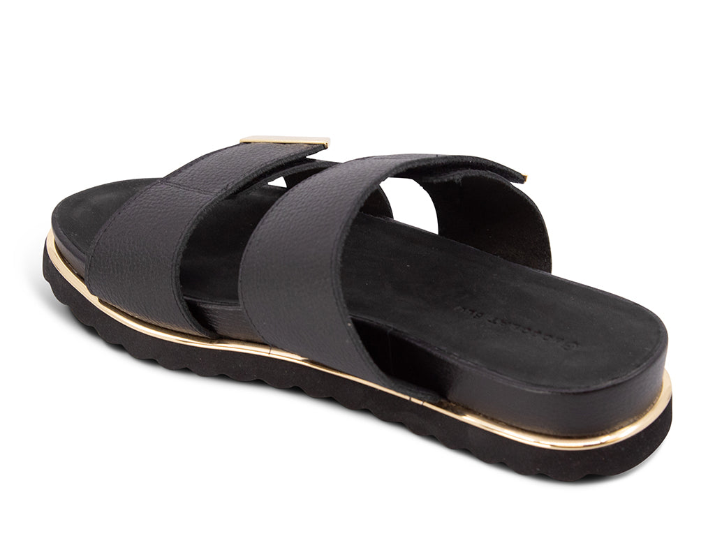 black sandal with black track sole and gold accents - view from the back