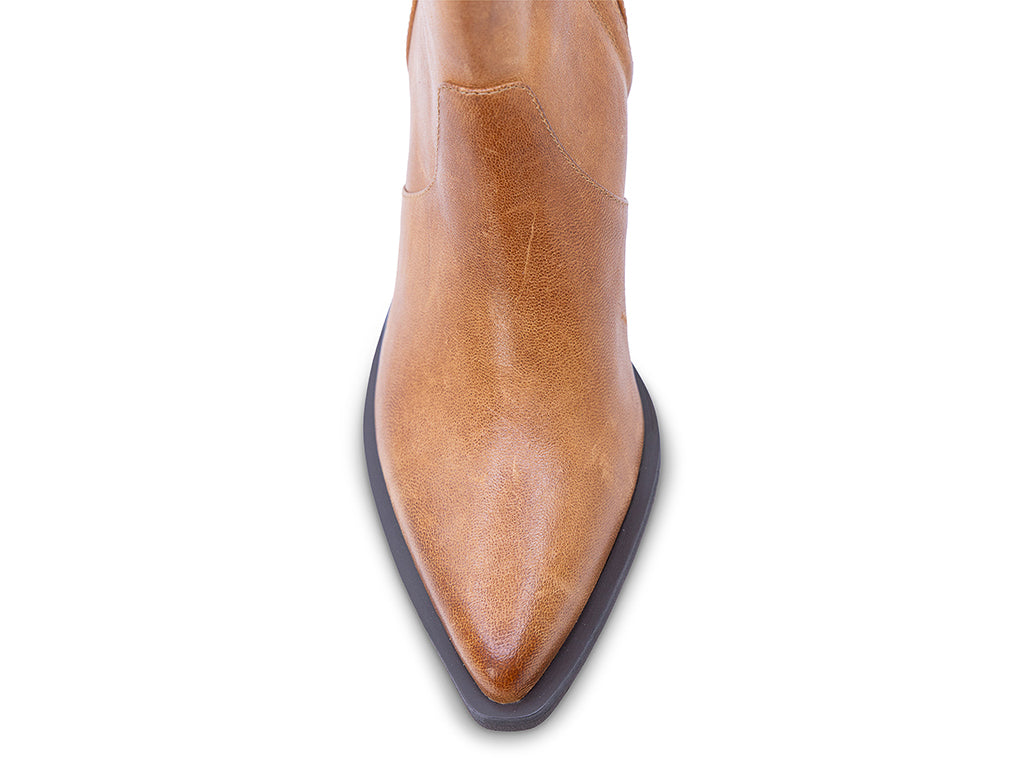 A caramel-colored leather ankle boot with a pointed toe and a low block heel - view of the toe shape