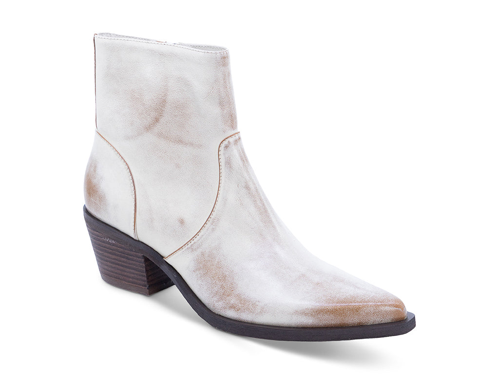A vintage white leather ankle boot with a pointed toe and a low block heel - front 3/4 view