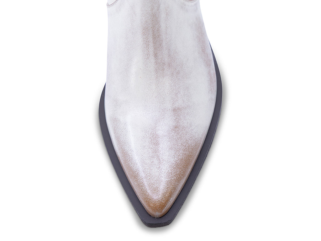 A vintage white leather ankle boot with a pointed toe and a low block heel - view of the toe shape