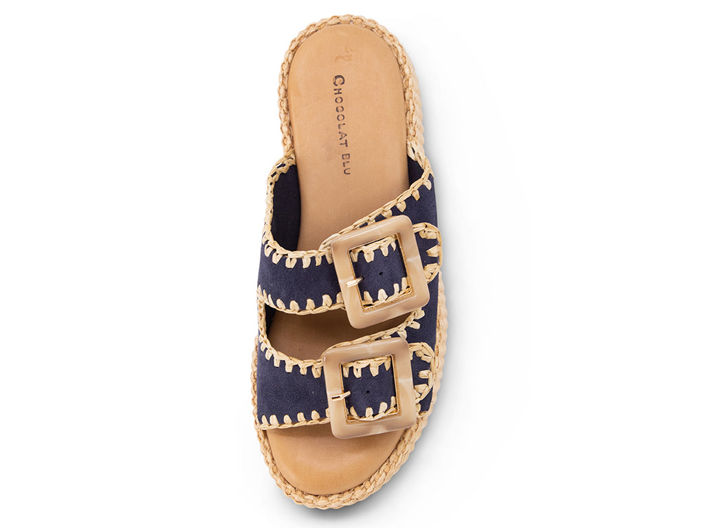 blue suede upper sandal with buckles on a raffia wrapped platform-top view
