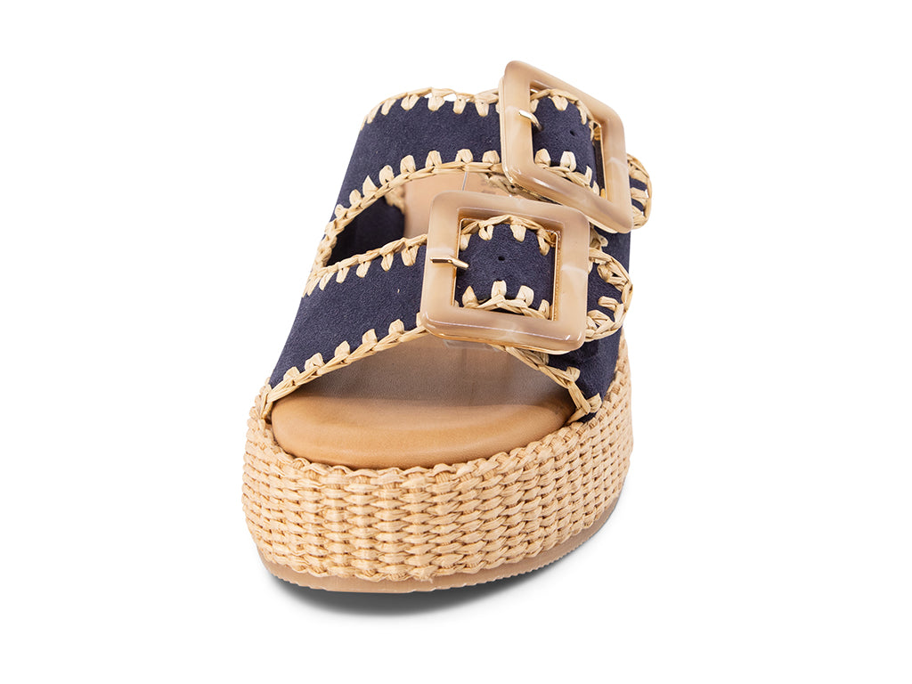 blue suede upper sandal with buckles on a raffia wrapped platform - view from the front