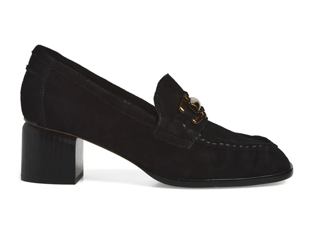A black suede penny loafer with a block heel and a polished gold-tone horsebit detail across the vamp - side view