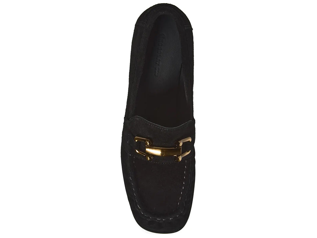 A black suede penny loafer with a block heel and a polished gold-tone horsebit detail across the vamp - top view