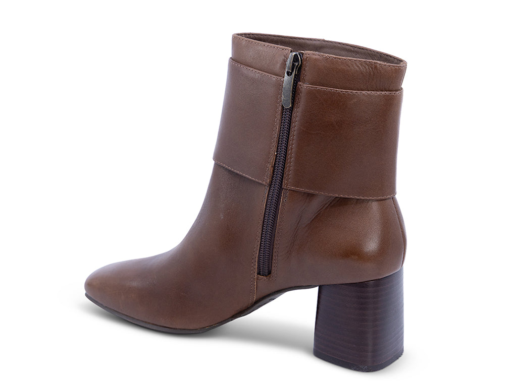 A brown leather ankle boot with a square toe, a block heel, and a wide strap with a rectangular buckle - inner side view