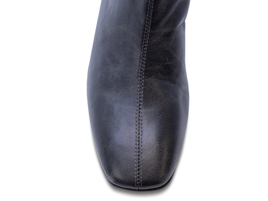 distressed black leather ankle boot with block heel - view of the toe shape