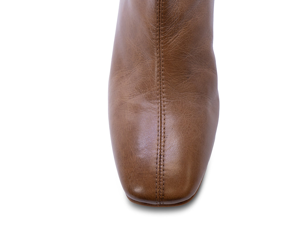 distressed brown leather ankle boot with block heel - view of the toe shape