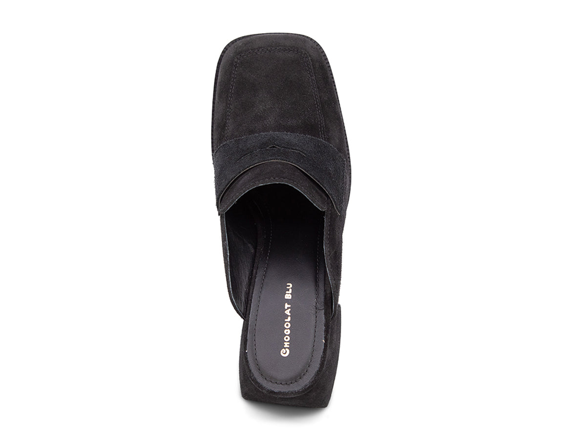 Black suede slide shoe with a block heel and penny loafer design on a white background top view