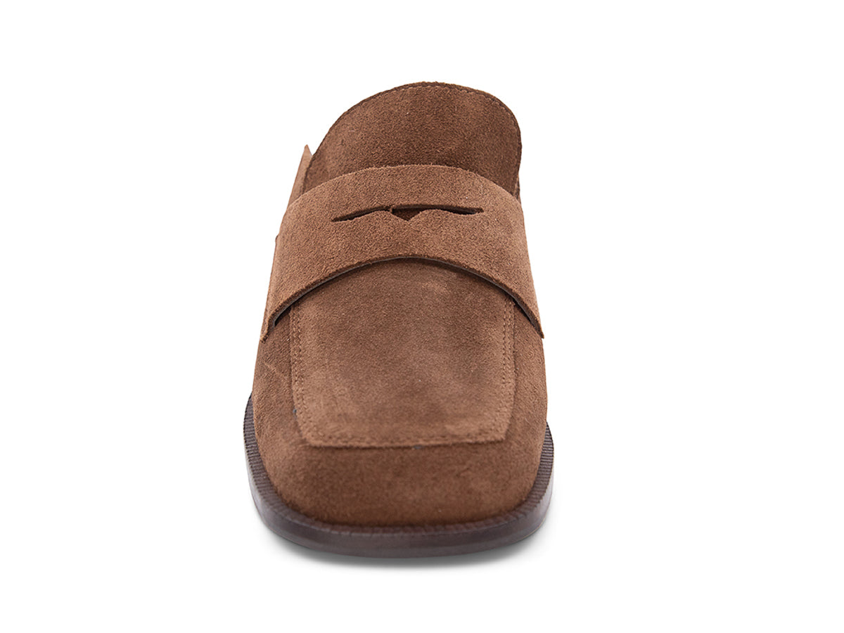 Brown suede slide shoe with a block heel and penny loafer design on a white background front view