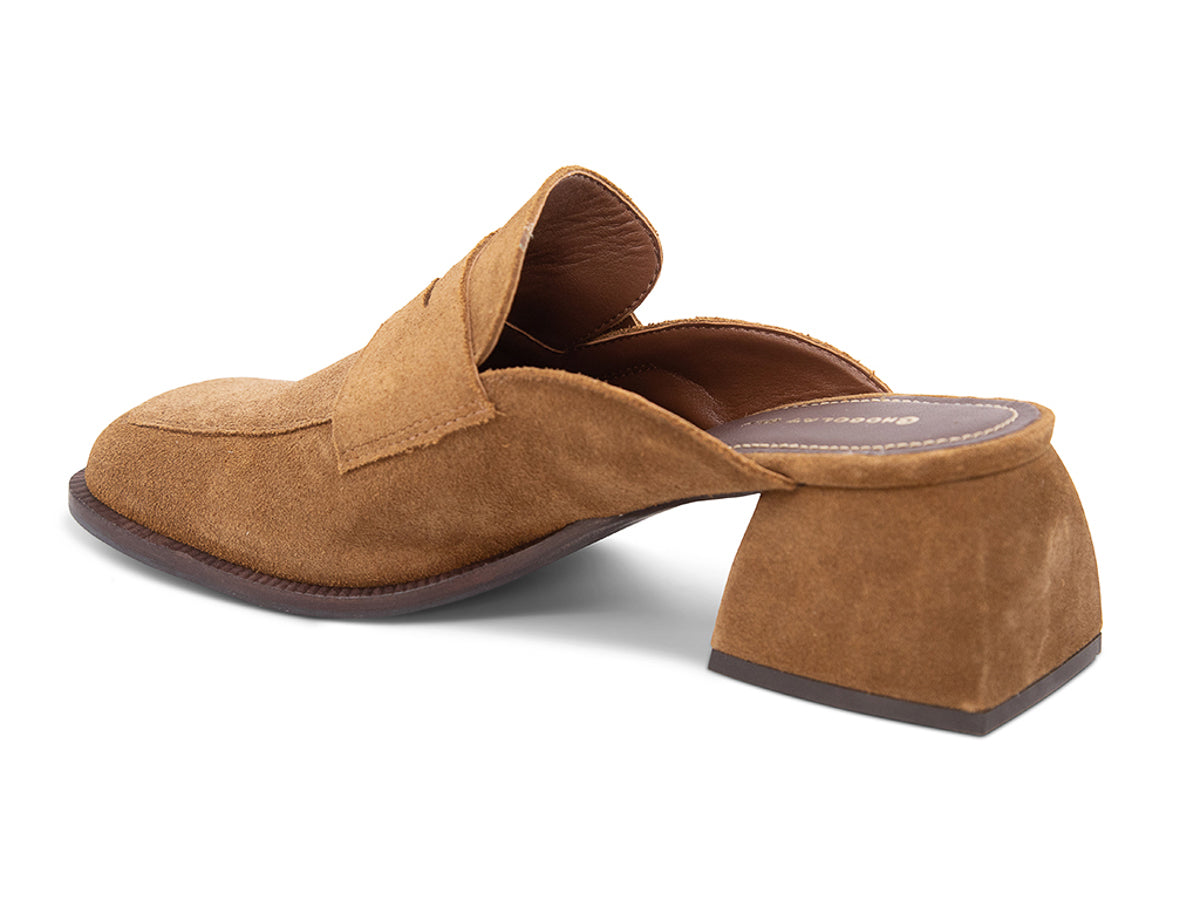 Camel suede slide shoe with a block heel and penny loafer design on a white background side angle view
