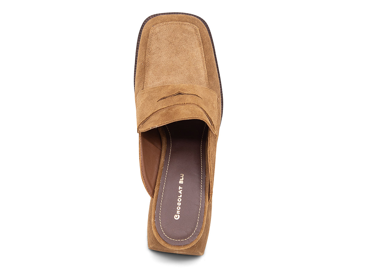 Camel suede slide shoe with a block heel and penny loafer design on a white background top view