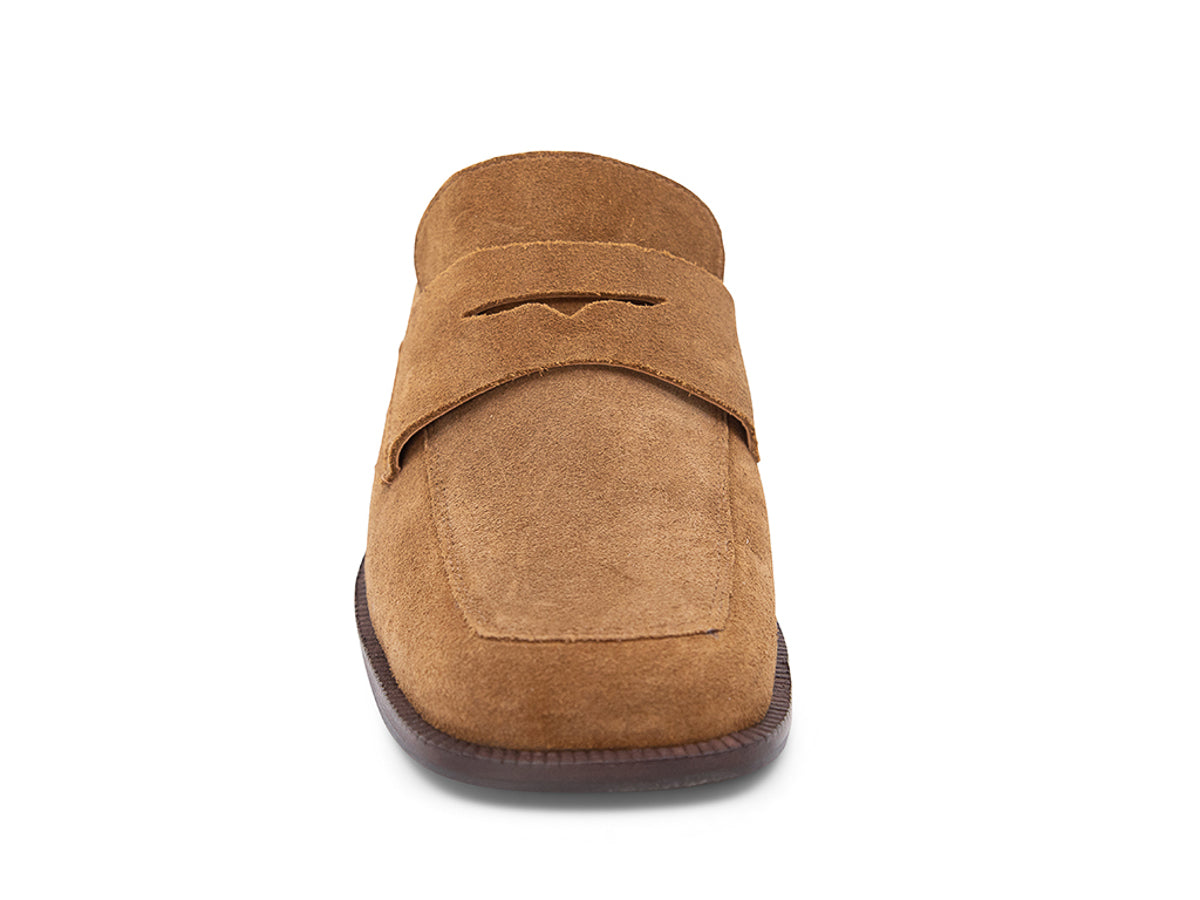 Camel suede slide shoe with a block heel and penny loafer design on a white background front view