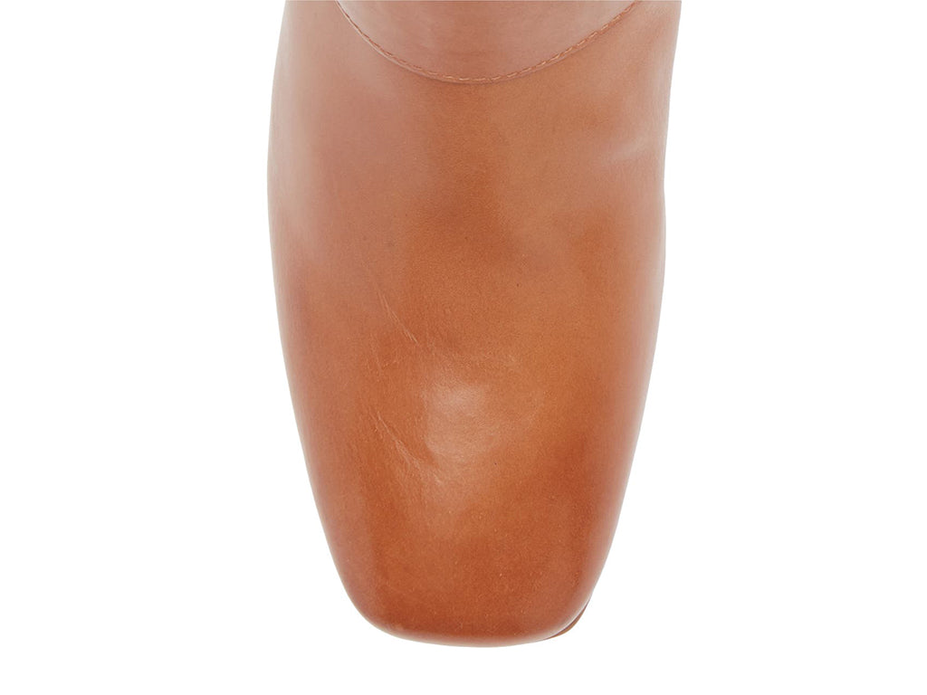 Camel ankle boot on a white background top toe front of boot view