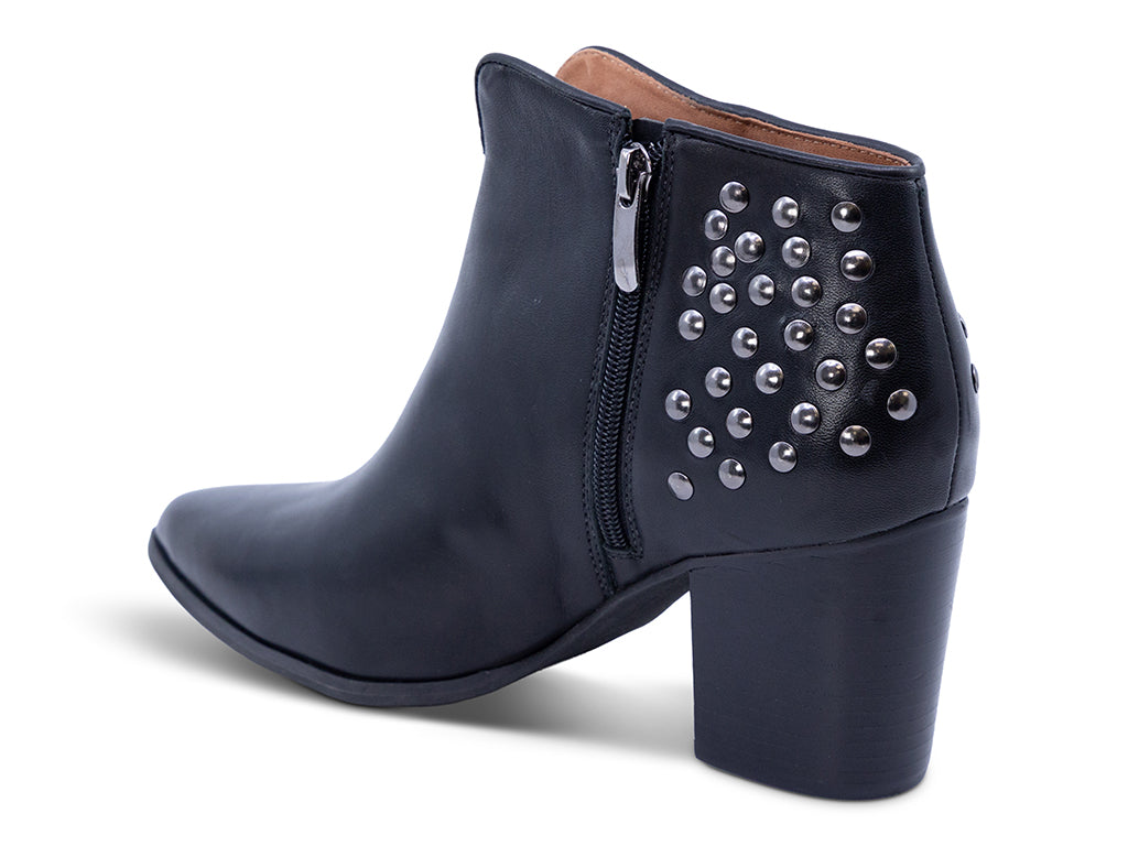 black leather ankle bootie with studs and a block heel - inner side view