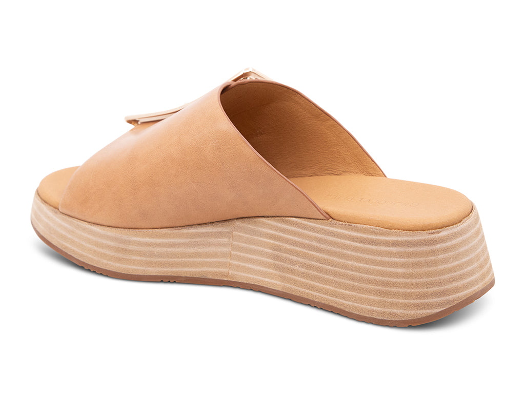 camel wedge slide sandal with an oversized gold buckle - back angle view