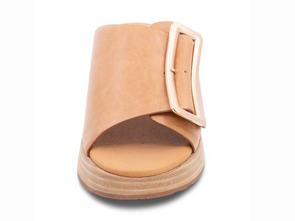 camel wedge slide sandal with an oversized gold buckle - front view