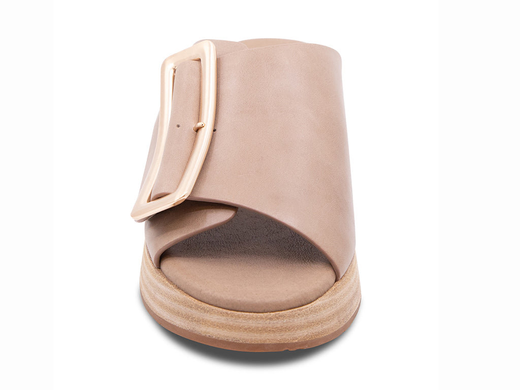 light khaki colored wedge slide sandal with oversized buckle - front view