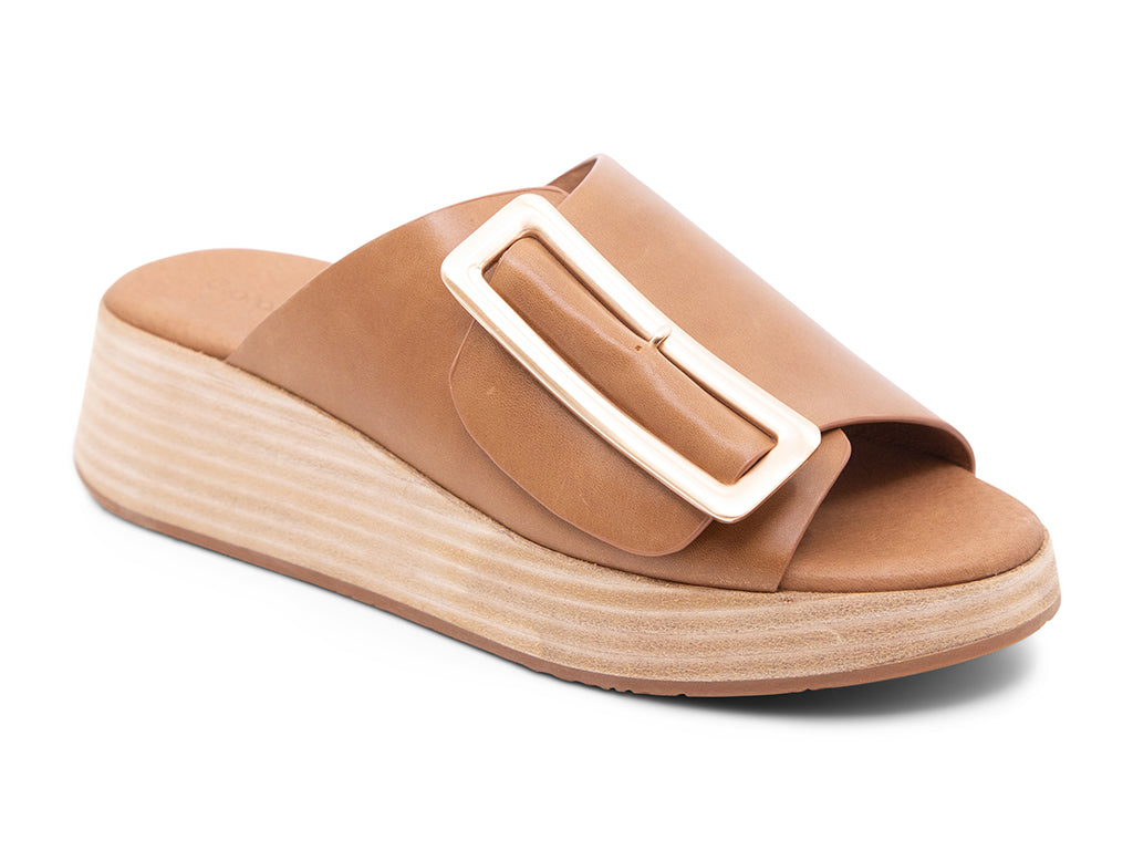 saddle colored wedge slide sandal with oversized buckle 