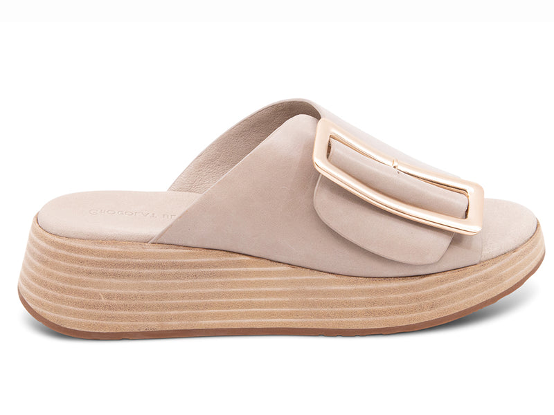 beige wedge slide sandal with an oversized gold buckle - side view