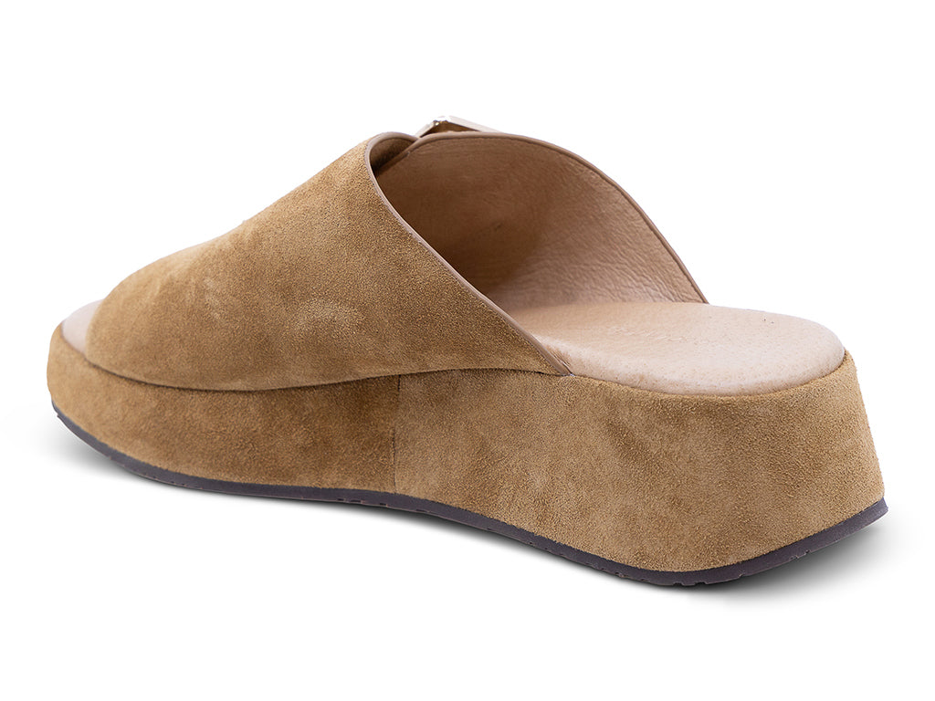 a camel suede wedge slide sandal with a wide strap and an oversized buckle - medial side view