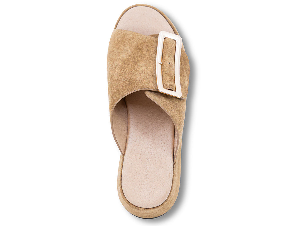 a camel suede wedge slide sandal with a wide strap and an oversized buckle - top view