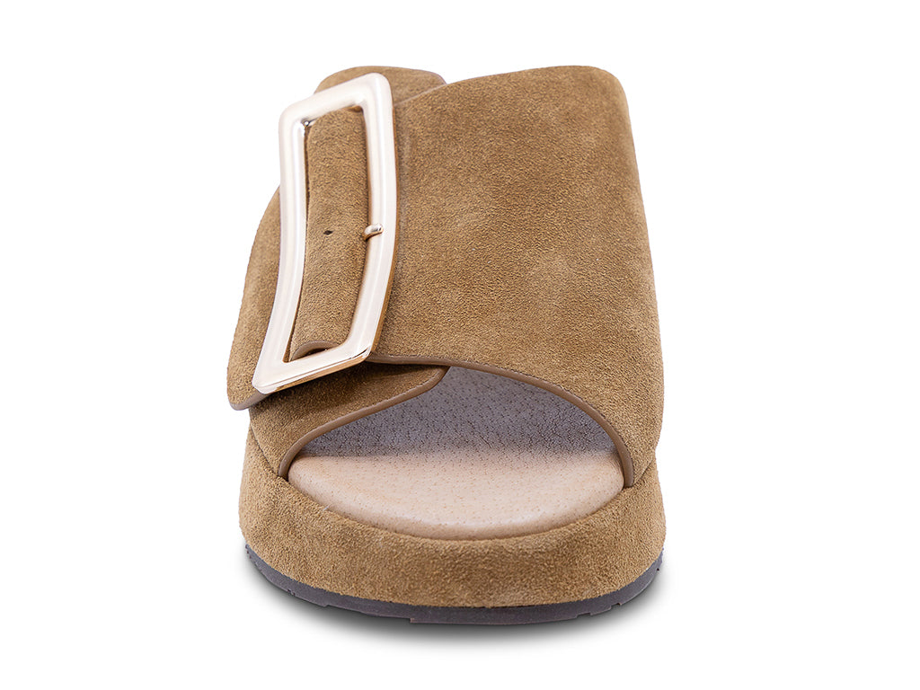 a camel suede wedge slide sandal with a wide strap and an oversized buckle - front view of the toe shape and the upper