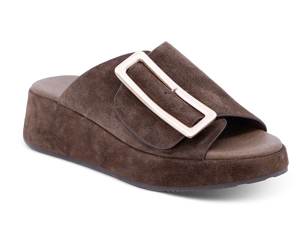 a chocolate suede wedge slide sandal with a wide strap and an oversized buckle - front 3/4 view
