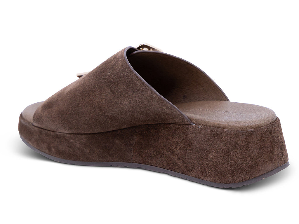 a chocolate suede wedge slide sandal with a wide strap and an oversized buckle - medial side view