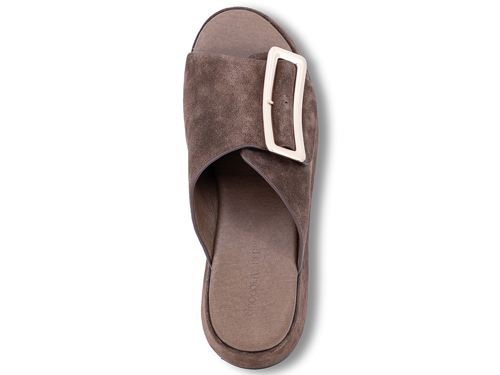 a chocolate suede wedge slide sandal with a wide strap and an oversized buckle - top view