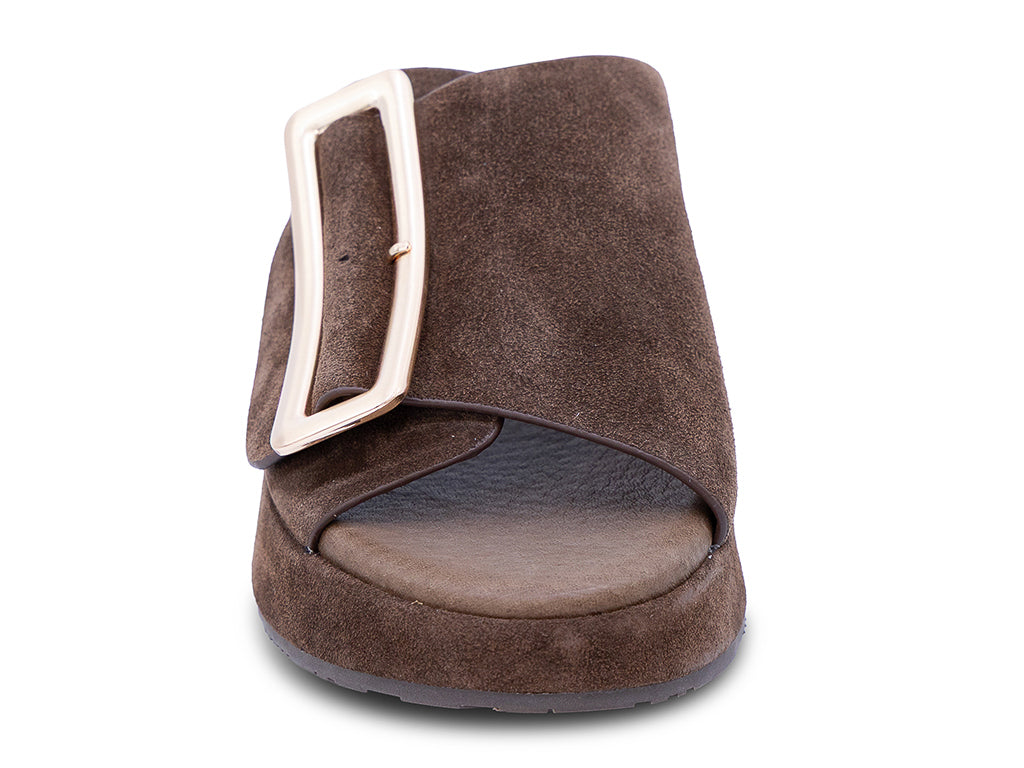 a chocolate suede wedge slide sandal with a wide strap and an oversized buckle - front view of toe shape and upper
