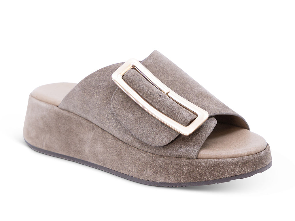 a dark taupe suede wedge slide sandal with a wide strap and an oversized buckle - front 3/4 view