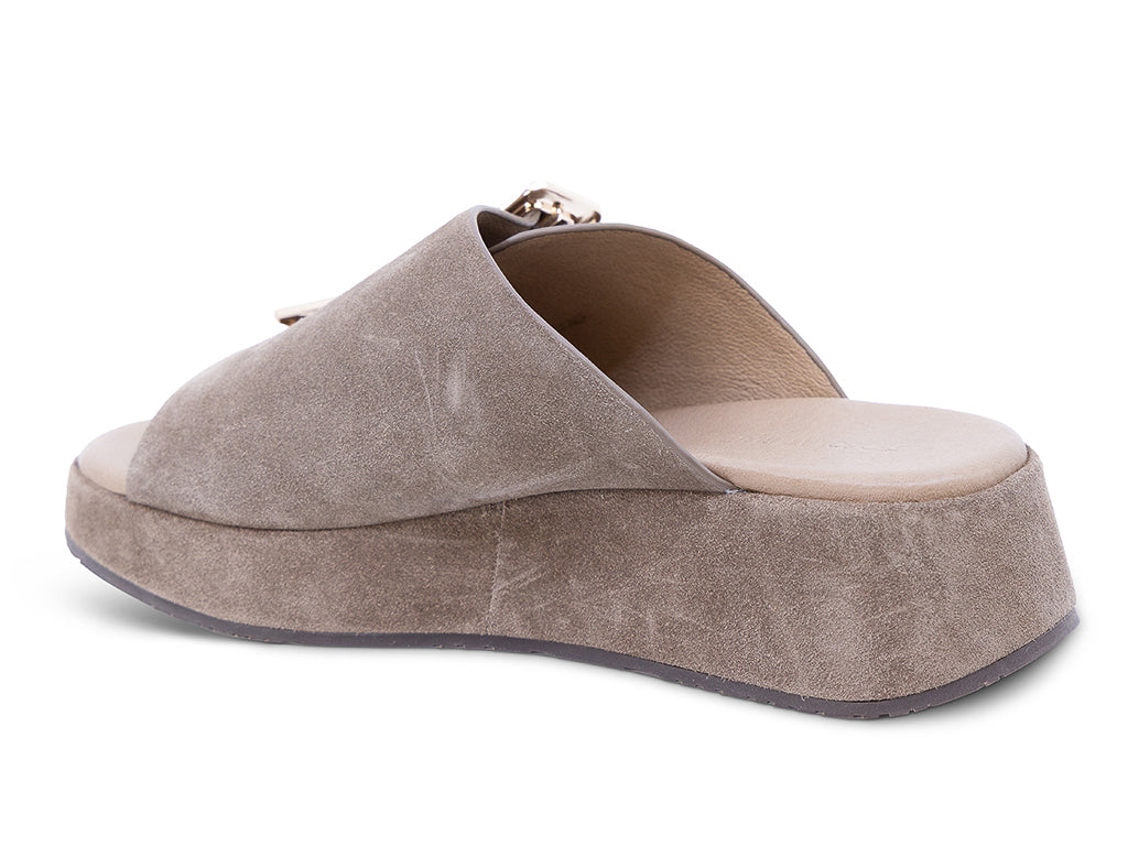 a dark taupe suede wedge slide sandal with a wide strap and an oversized buckle - medial side view