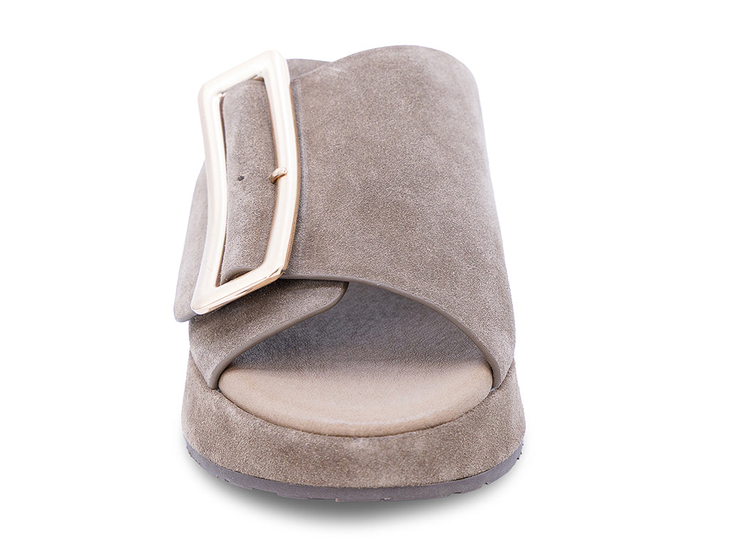 a dark taupe suede wedge slide sandal with a wide strap and an oversized buckle - front vie of the toe shape and upper