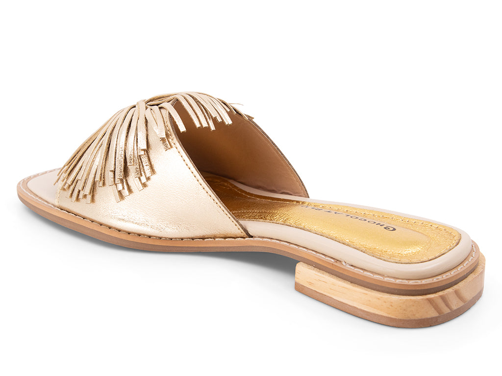 gold metallic low heel sandal with pom-pom ornament - view from the back