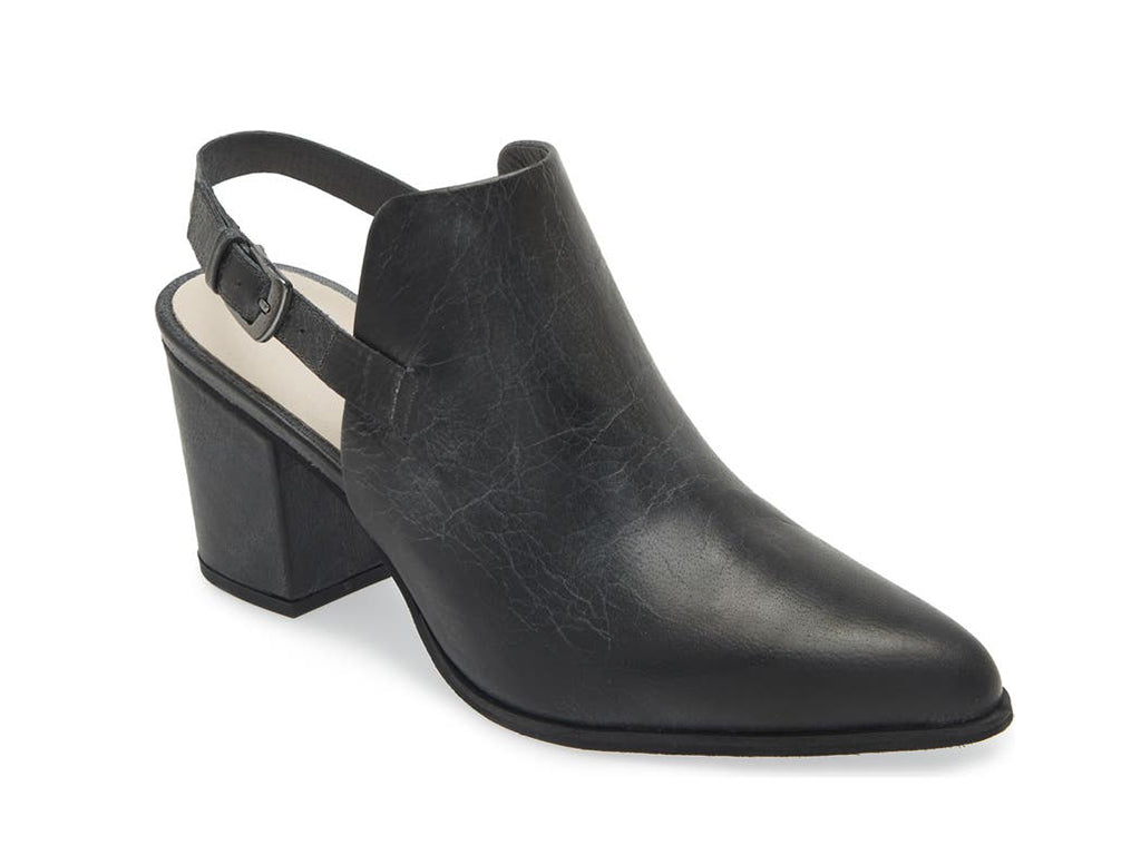 Black pointed toe shoe with block heel and buckle ankle back strap on a white background side angle view